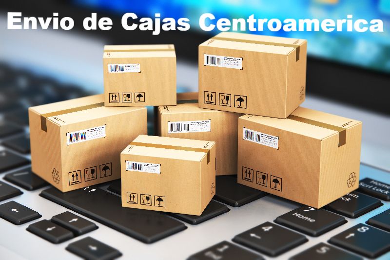 Cardboard boxes with shipping labels on a laptop keyboard, 